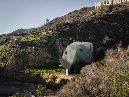 Image of Last House on Mulholland, a space-ship looking house nestled beneath the Hollywood sign.