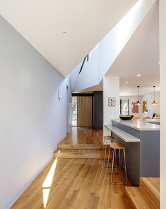 Interior shot of a kitchen with an angled roof