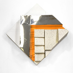 Physical model with white and mirrored surfaces and a yellow staircase.